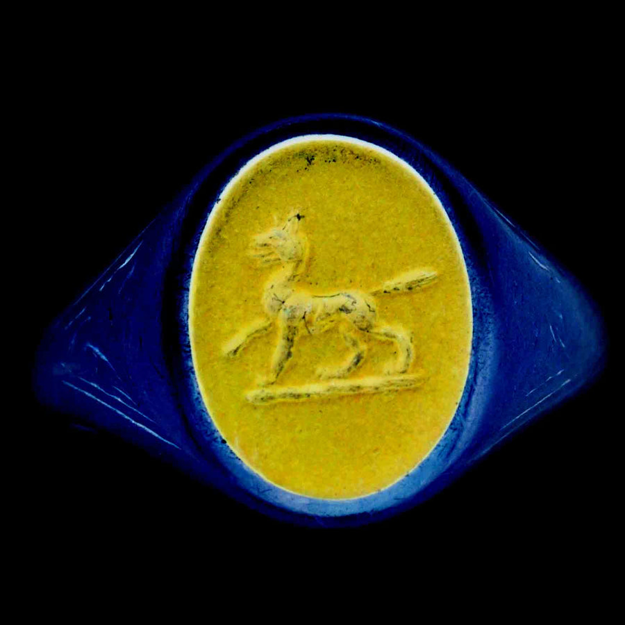 1960s 18ct gold signet ring with lapis lazuli intaglio of a wolf, showcasing intricate craftsmanship and heraldic design.