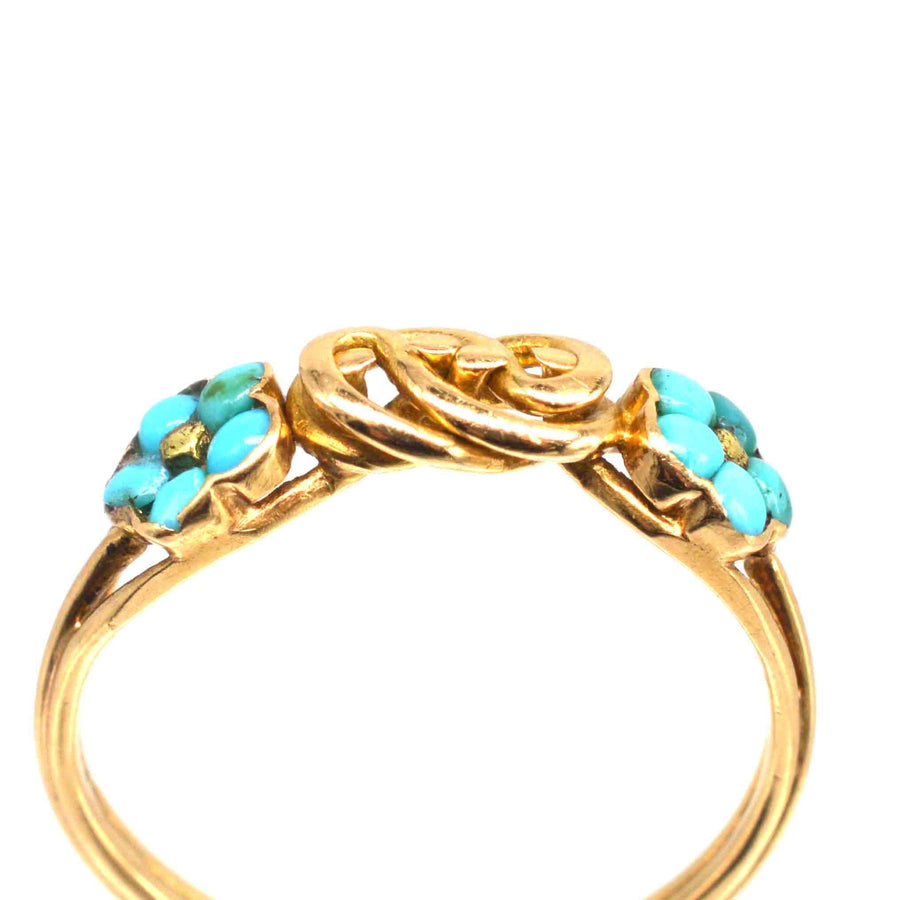 Regency 18ct gold knot ring with turquoise forget-me-not flowers, symbolizing love and remembrance.