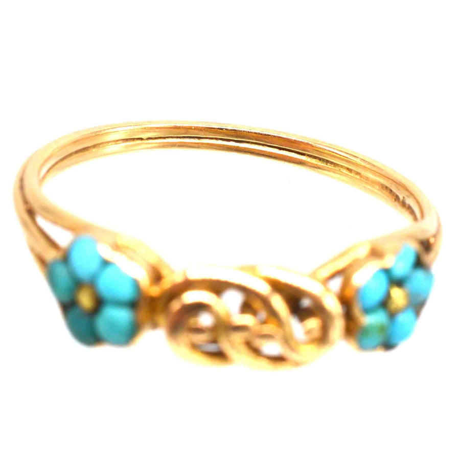Regency 18ct gold ring with turquoise forget-me-not flowers and a gold lover's knot, symbolizing eternal love.