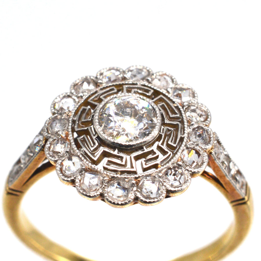 Art Deco gold and platinum diamond ring with Greek key design and Old European Cut diamond.