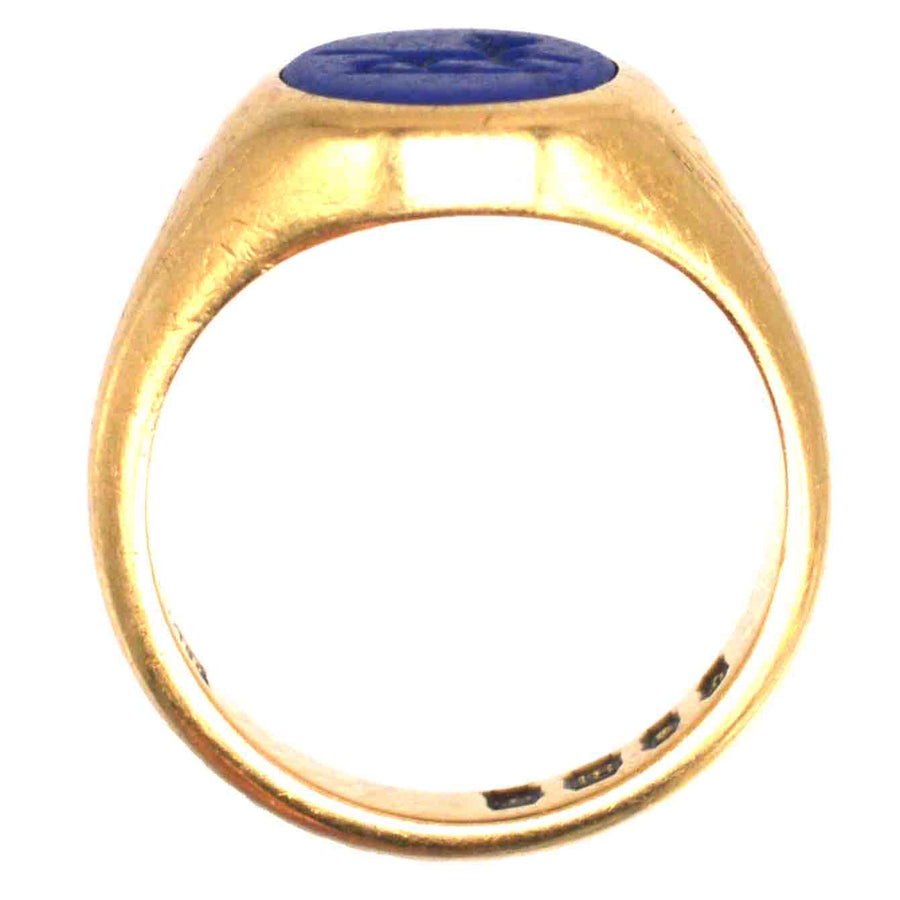 1960s 18ct gold signet ring with lapis lazuli intaglio, featuring intricate wolf design.